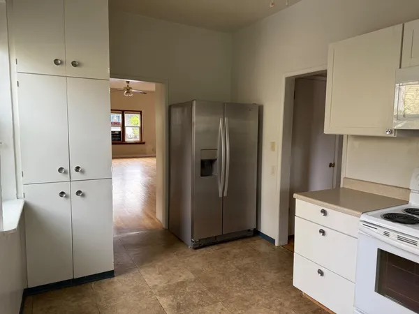 a view of cabinets with wooden floor