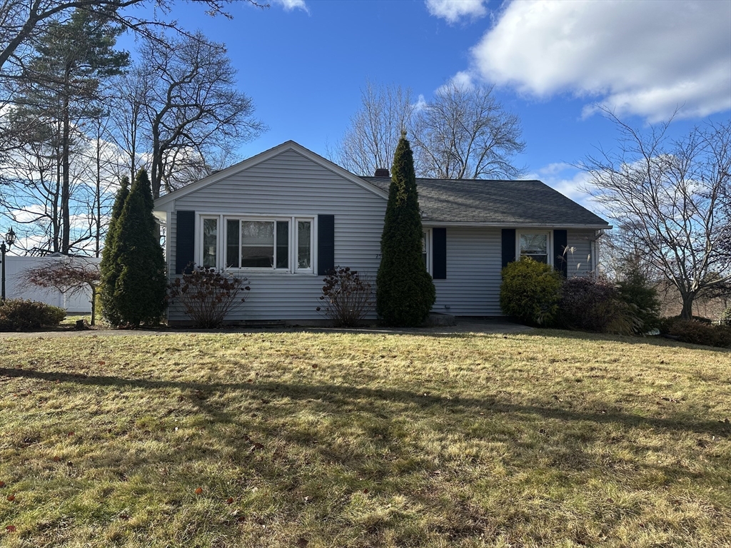 254 Hartwick Street Springfield, MA 01108 - Photo 1 of 17 a front view of a house with a garden