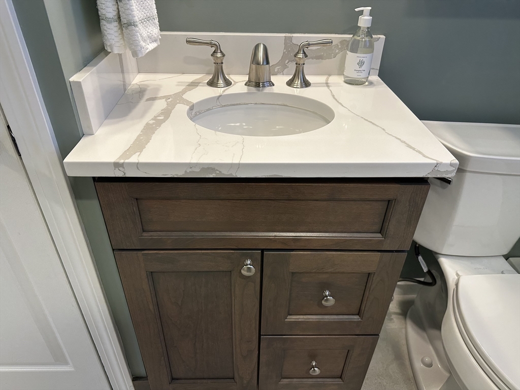 254 Hartwick Street Springfield, MA 01108 - Photo 11 of 17 a bathroom with a sink and a toilet