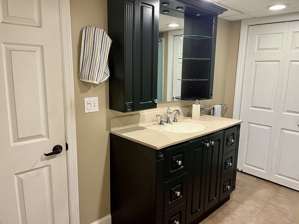 254 Hartwick Street Springfield, MA 01108 - Photo 13 of 17 a bathroom with a sink and a mirror