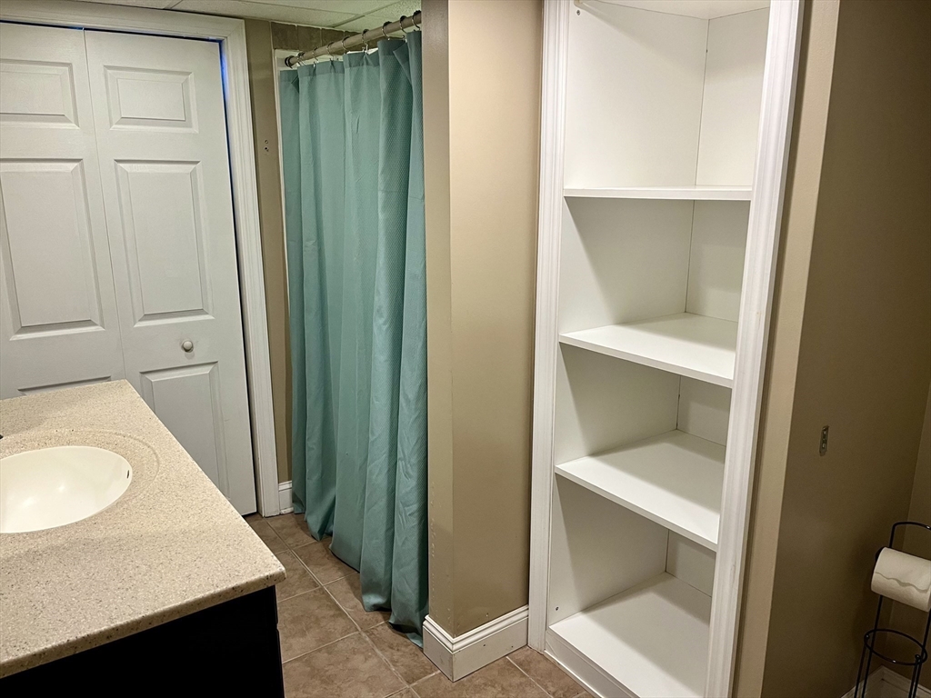 254 Hartwick Street Springfield, MA 01108 - Photo 14 of 17 a bathroom with a sink and toilet