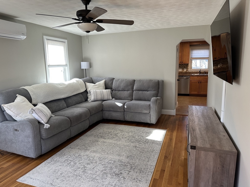 254 Hartwick Street Springfield, MA 01108 - Photo 6 of 17 a living room with furniture and a flat screen tv