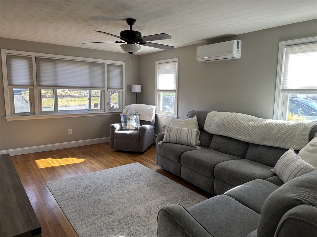 254 Hartwick Street Springfield, MA 01108 - Photo 7 of 17 a living room with furniture and a window