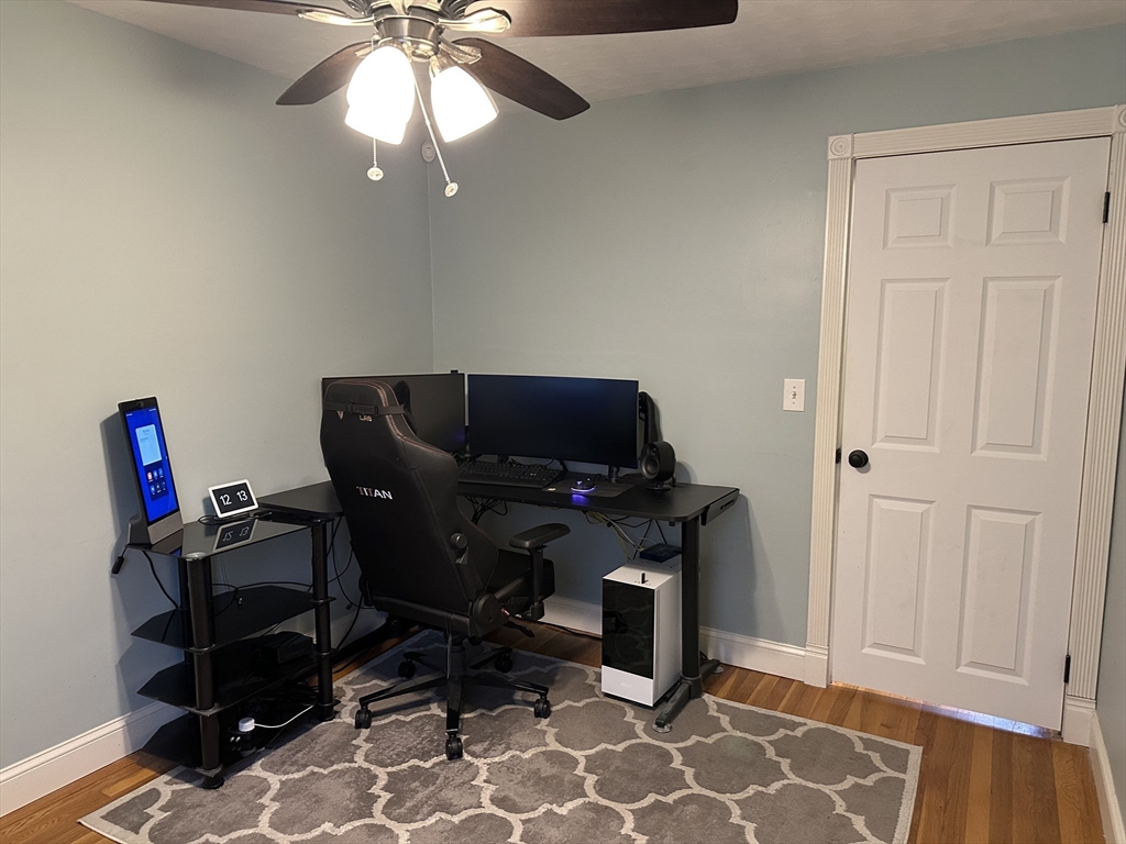 254 Hartwick Street Springfield, MA 01108 - Photo 9 of 17 a view of a workspace with furniture and a window