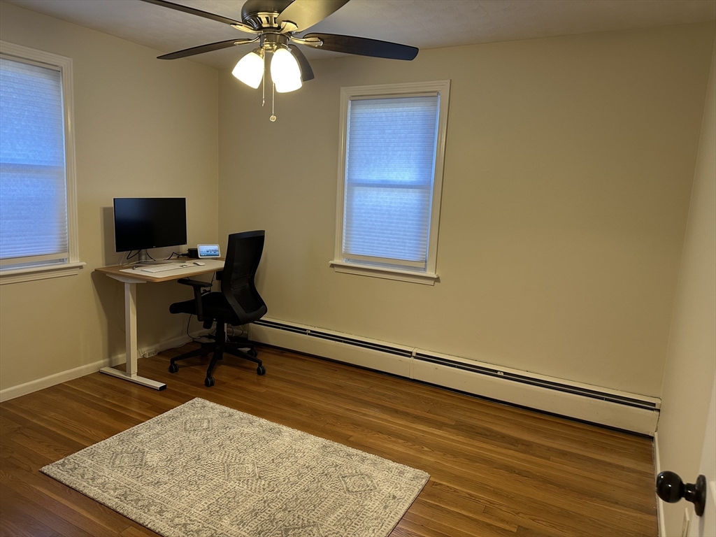 254 Hartwick Street Springfield, MA 01108 - Photo 10 of 17 a view of a workspace with furniture and a window