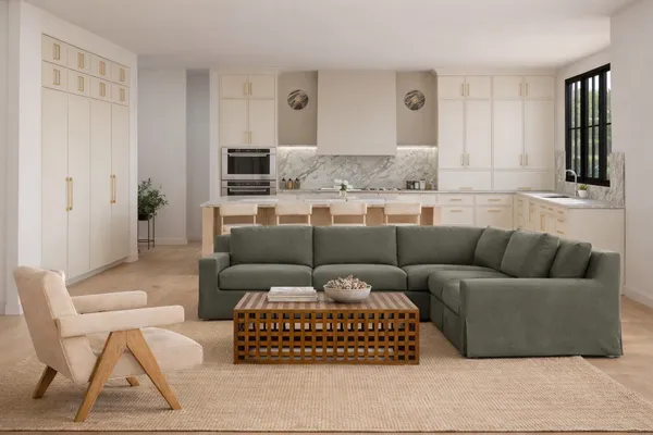 a living room with a couch and a window