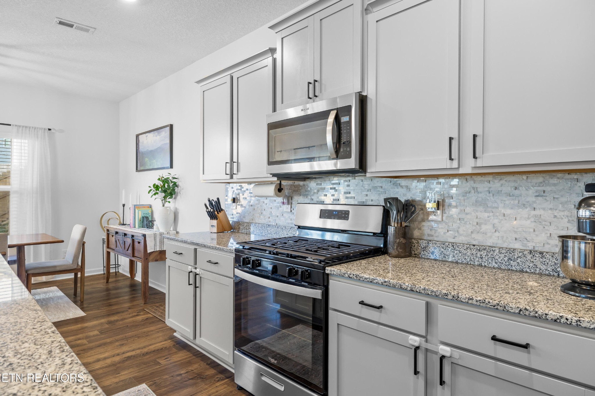 2918 Red Flame Road Knoxville, TN 37921 - Photo 12 of 39 a kitchen with stainless steel appliances granite countertop a stove a sink and a microwave