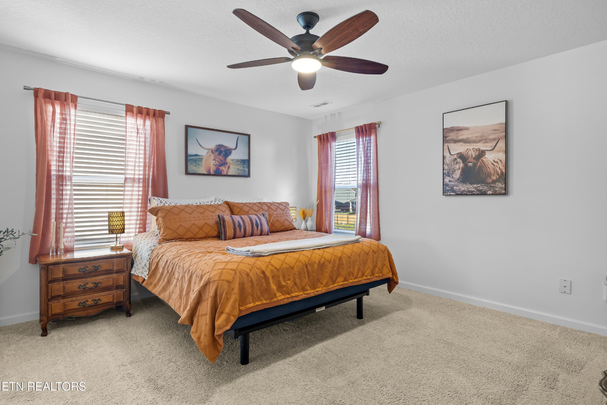 2918 Red Flame Road Knoxville, TN 37921 - Photo 20 of 39 a spacious bedroom with a bed and a ceiling fan