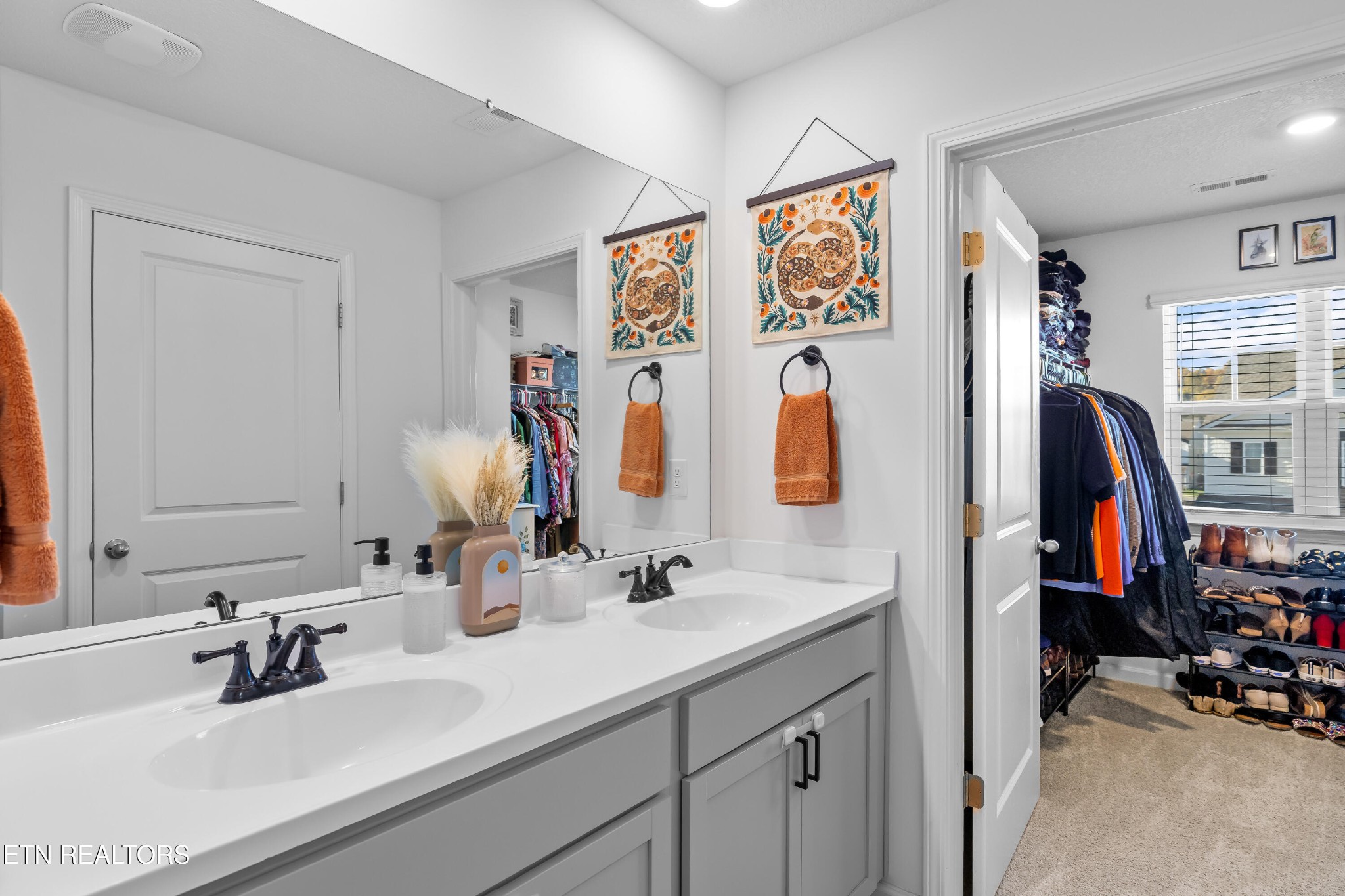 2918 Red Flame Road Knoxville, TN 37921 - Photo 22 of 39 a bathroom with double vanity sinks and a mirror