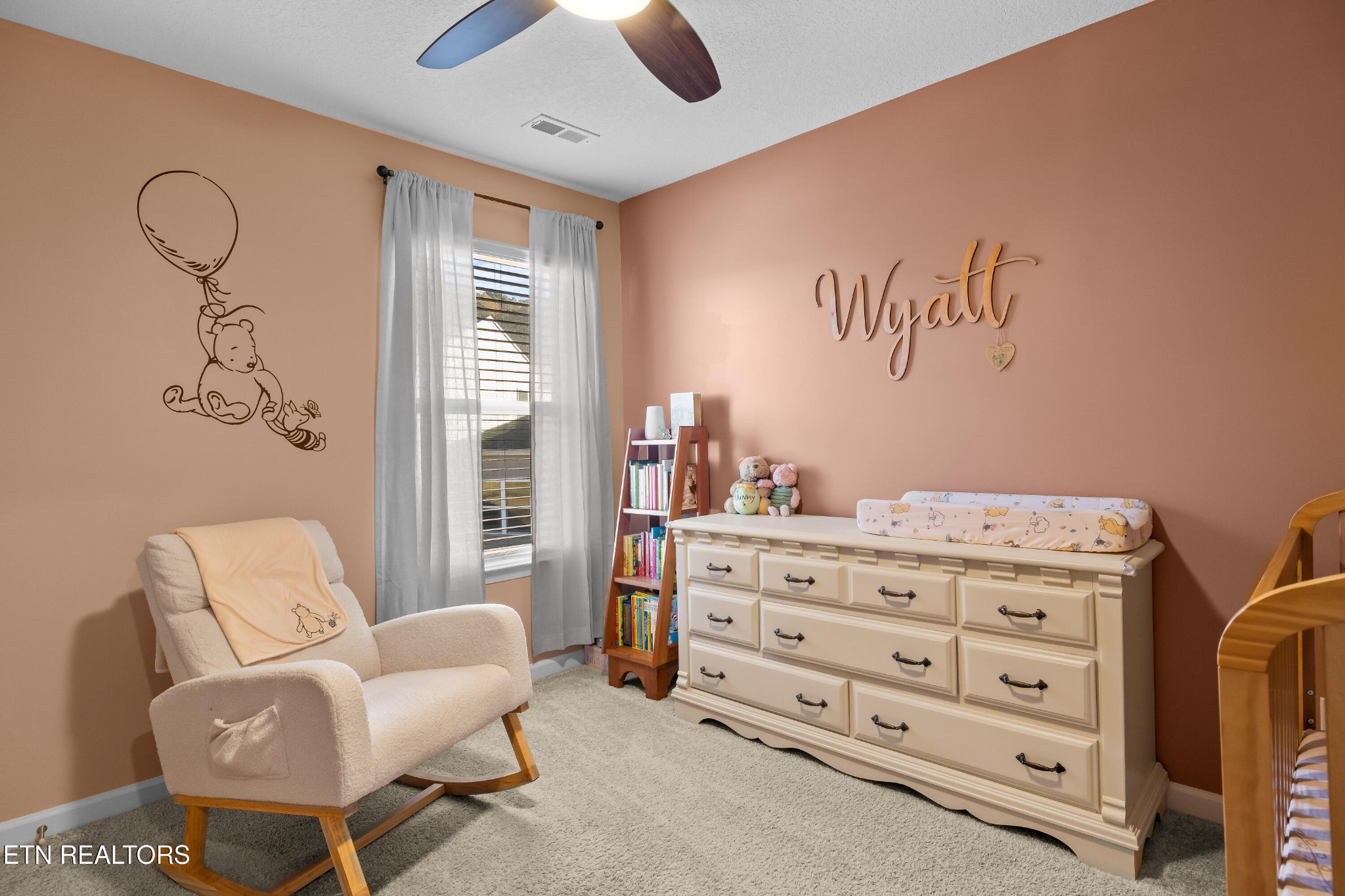 2918 Red Flame Road Knoxville, TN 37921 - Photo 27 of 39 a bedroom with a baby bed a couch and a dresser