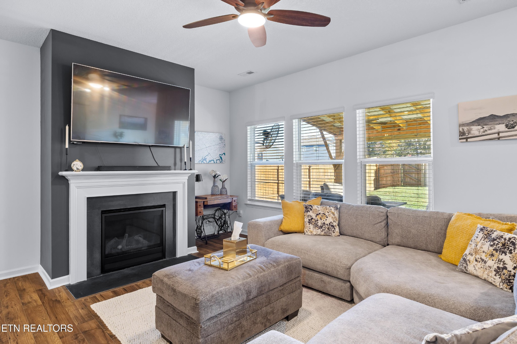 2918 Red Flame Road Knoxville, TN 37921 - Photo 9 of 39 a living room with furniture a flat screen tv and a fireplace