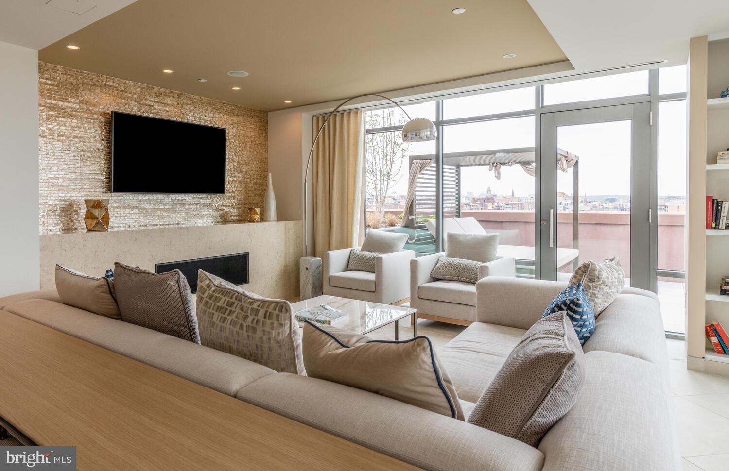 810 O Street Northwest, Unit 406 Washington, DC 20001 - Photo 38 of 43 Rooftop Clubroom w. TV and Fireplace