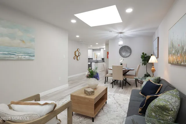 a living room with furniture and a clock