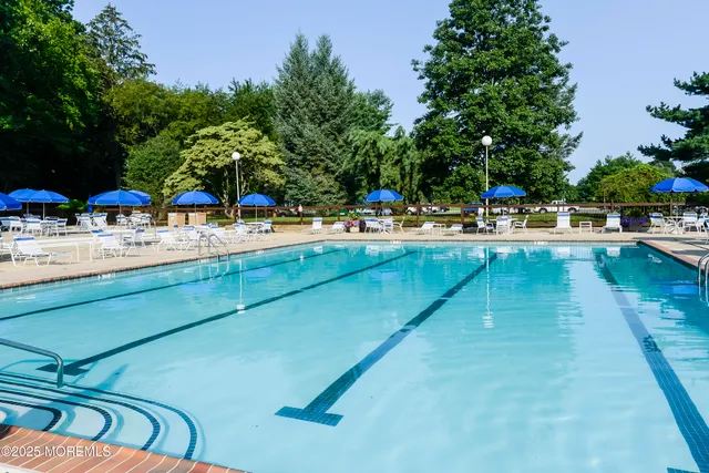 a view of house with swimming pool
