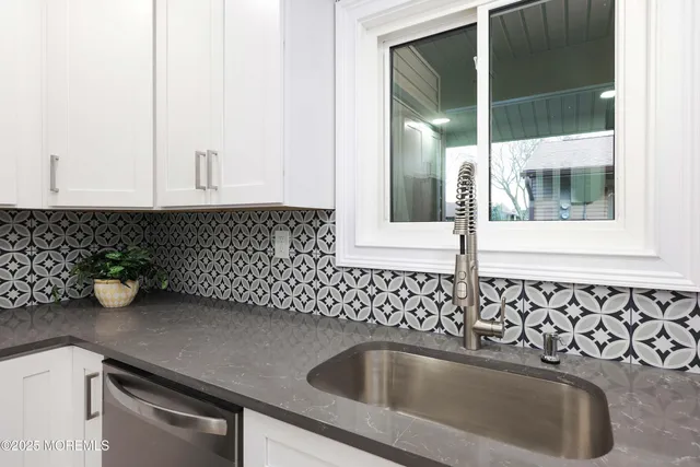 a kitchen with a sink and cabinets