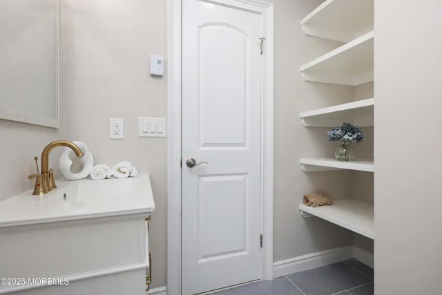 a bathroom with a sink and toilet