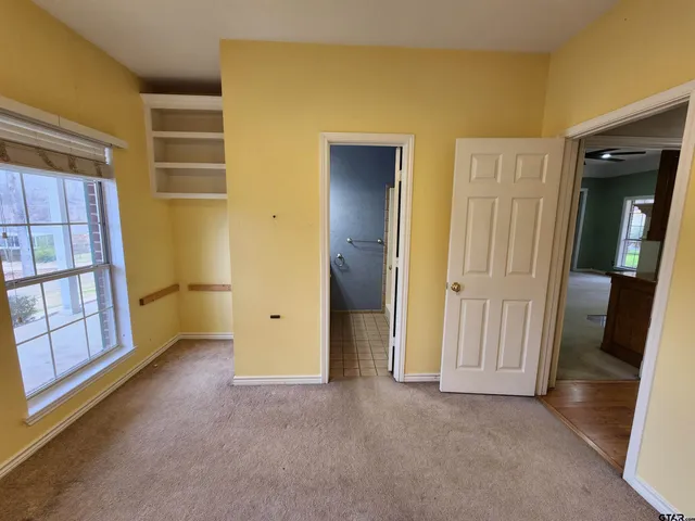 a view of hallway with wooden floor