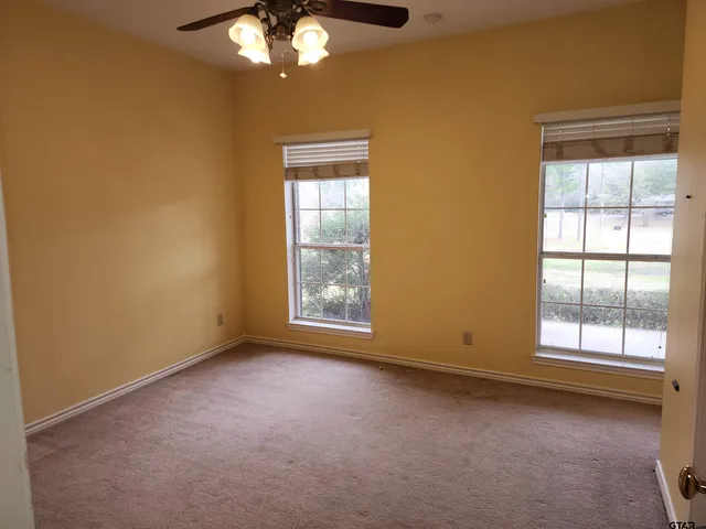 an empty room with windows