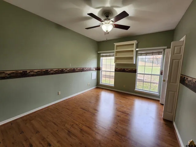 a bathroom with a sink and a glass door shower