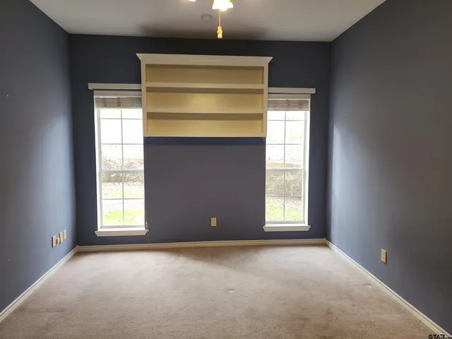 a white bath tub sitting next to a toilet