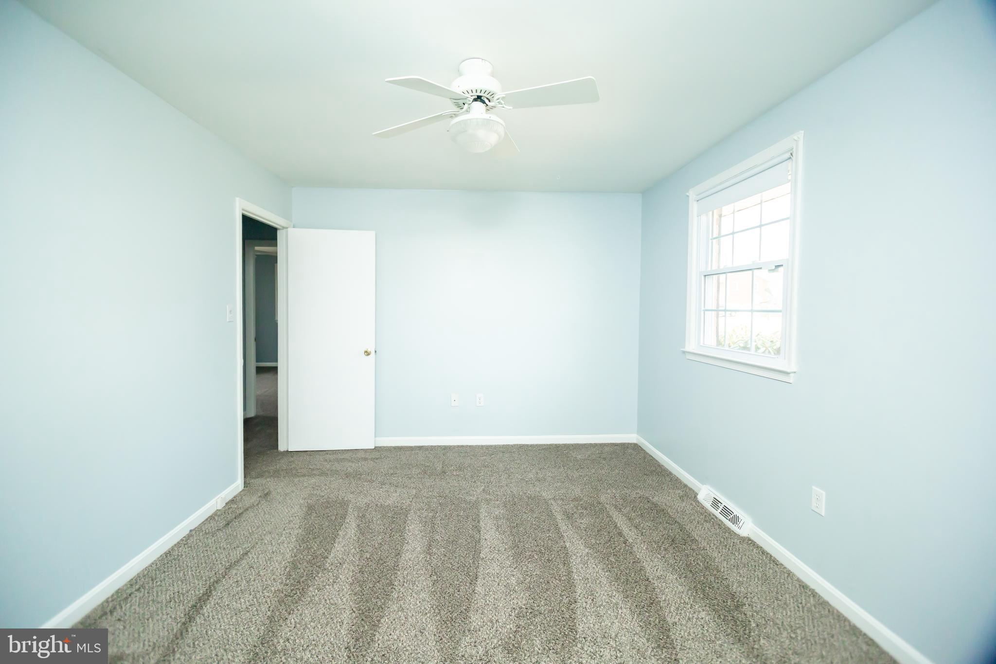11623 Rivershore Drive Dunkirk, MD 20754 - Photo 23 of 49 an empty room with a window and a ceiling fan
