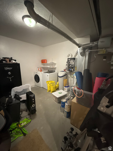3145 South 500 West Vernal, UT 84078 - Photo 35 of 64 Finished basement with a water softener, separate washer and dryer, and a textured ceiling