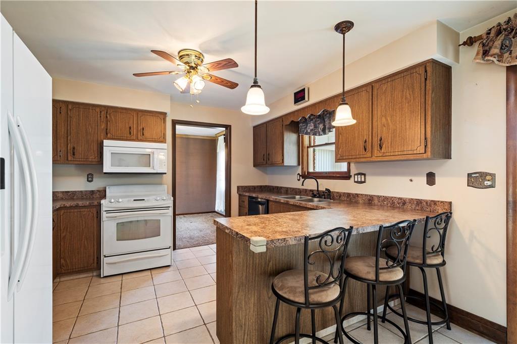 1241 Highland Road Monongahela, PA 15063 - Photo 13 of 40 Nice breakfast bar divider includes three barstools.