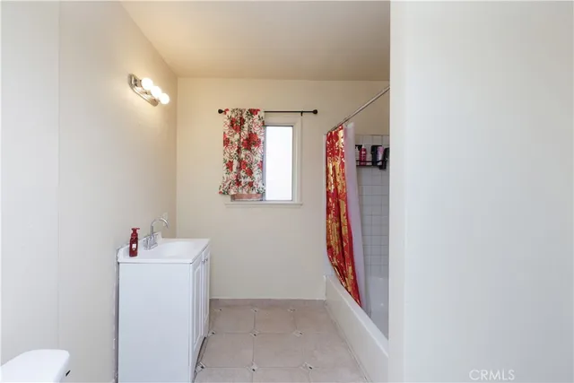a bathroom with a sink toilet and vanity