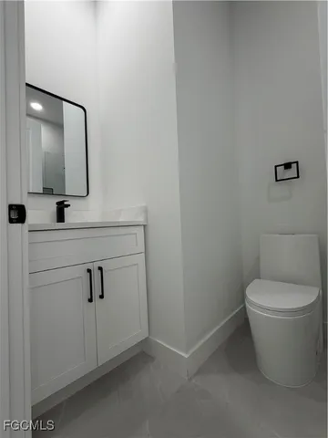 a white bath tub sitting next to a toilet