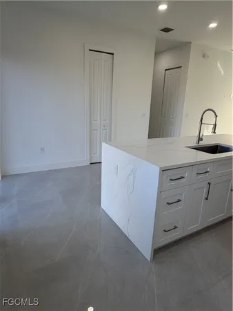 a kitchen with cabinets a sink and dishwasher
