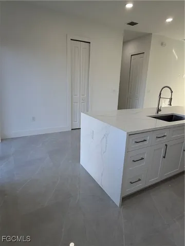 a kitchen with cabinets a sink and dishwasher