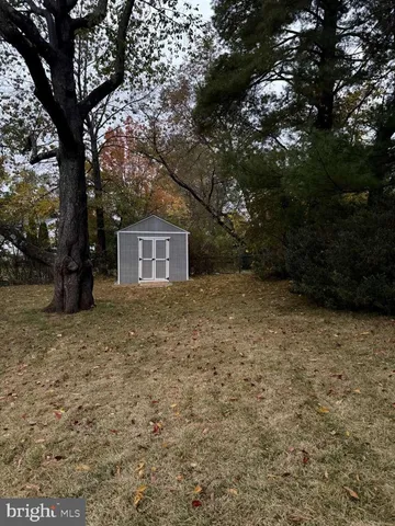 a house with trees in front of it