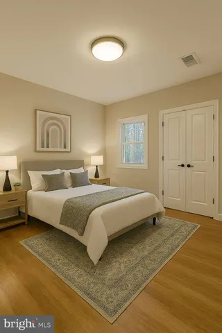 a spacious bedroom with a bed and a couch