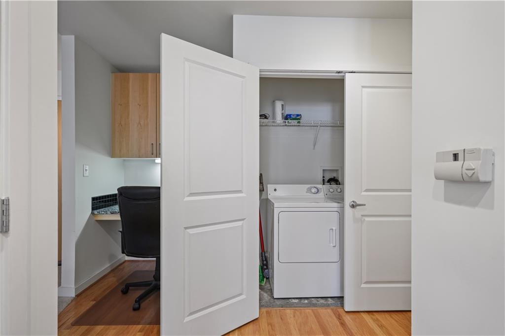 250 Pharr Road Northeast, Unit 606 Atlanta, GA 30305 - Photo 13 of 31 a room with a refrigerator and cabinets