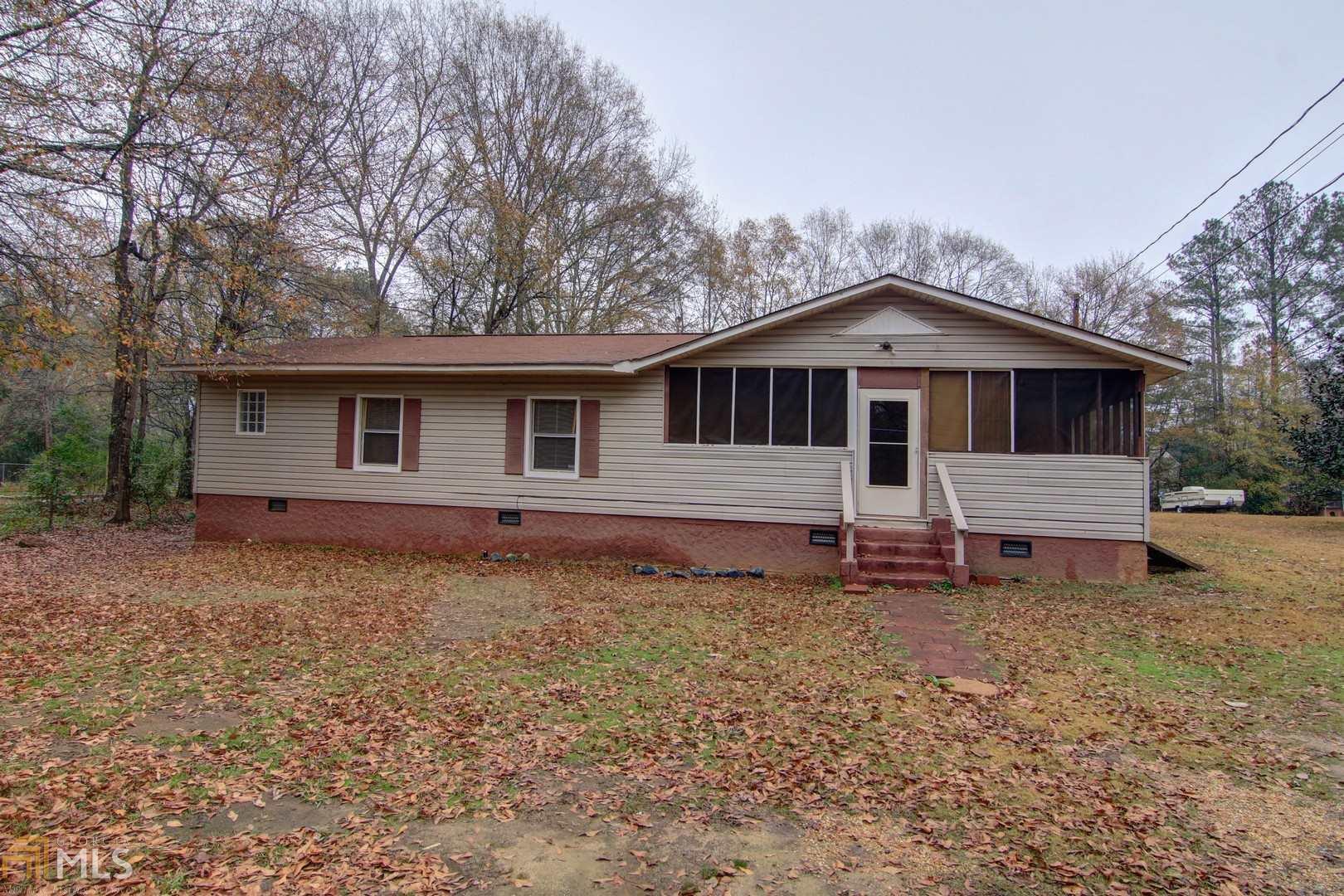 179 Ruby Road Jackson, GA 30233 - Photo 1 of 1 a front view of a house with a garden and trees