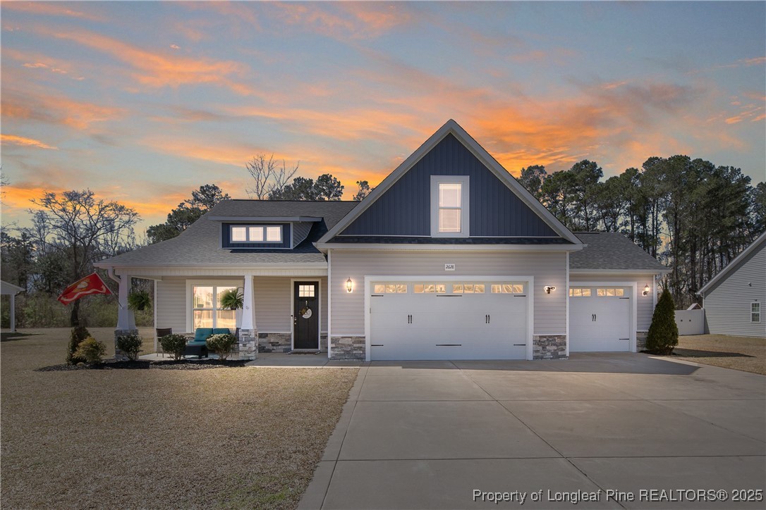 2628 Riddle Farm Road Hope Mills, NC 28348 - Photo 1 of 50 a view of a house with a yard and garage