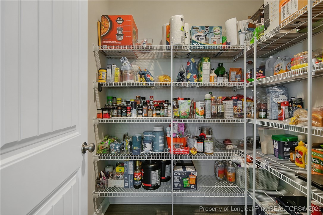 2628 Riddle Farm Road Hope Mills, NC 28348 - Photo 24 of 50 a room with lots of bottles of alcohol