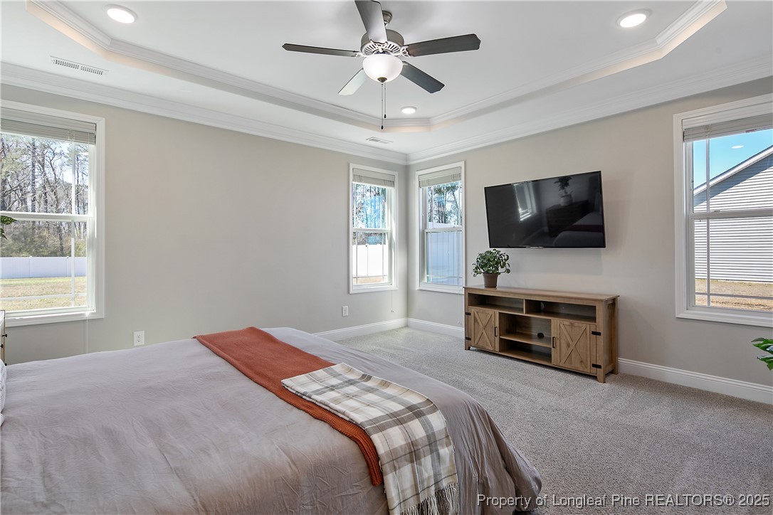 2628 Riddle Farm Road Hope Mills, NC 28348 - Photo 25 of 50 a bedroom with a bed and a flat screen tv
