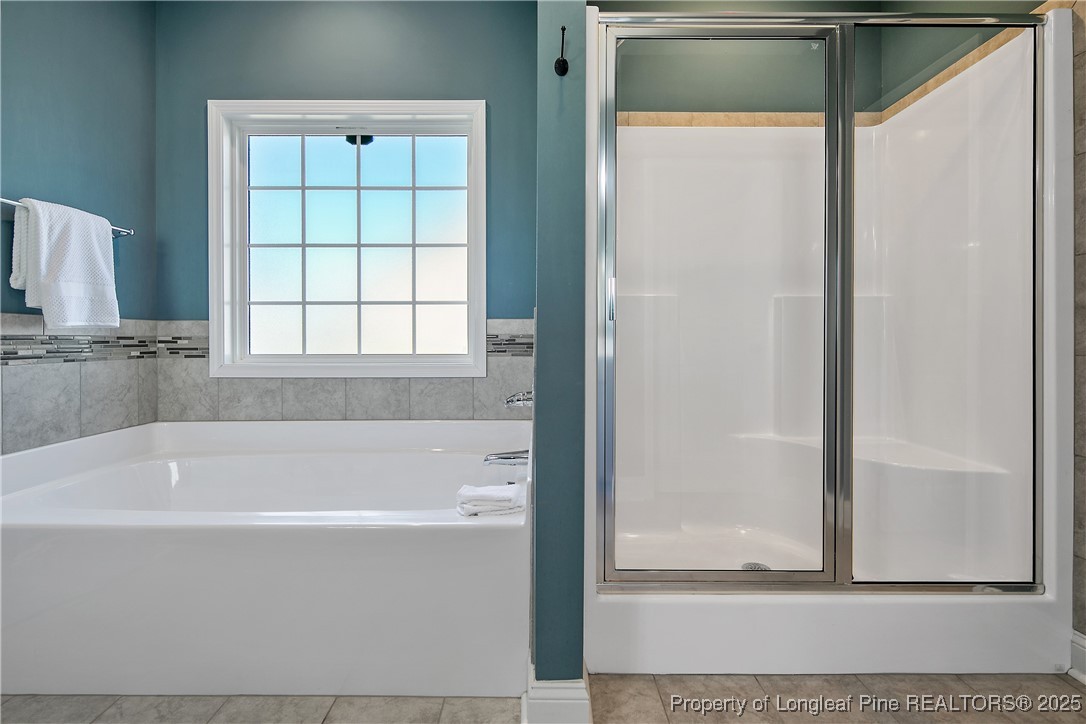 2628 Riddle Farm Road Hope Mills, NC 28348 - Photo 31 of 50 a white bath tub sitting next to a window