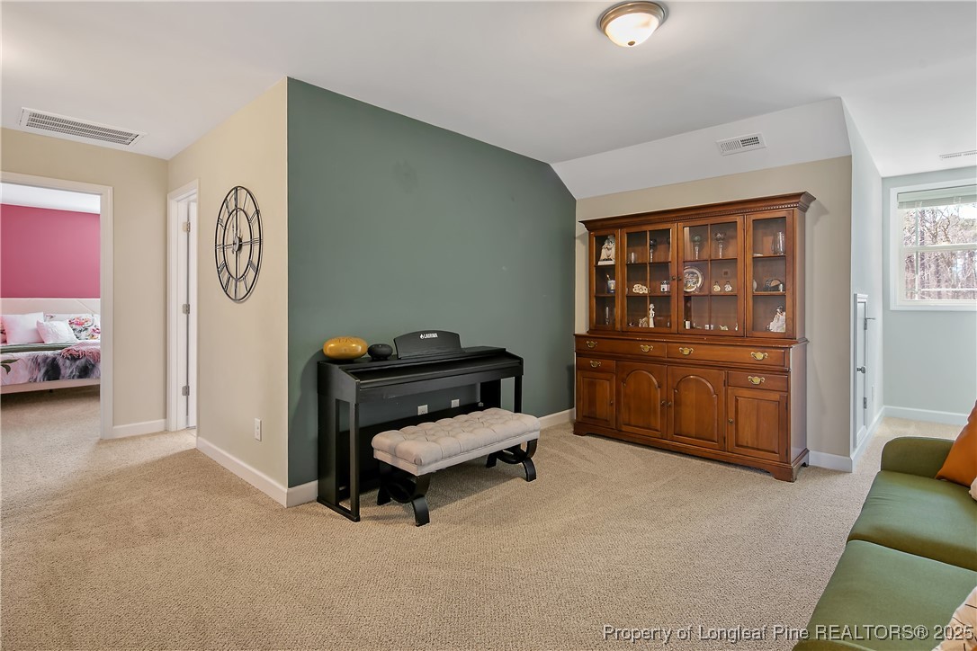 2628 Riddle Farm Road Hope Mills, NC 28348 - Photo 35 of 50 a bedroom with furniture and a window