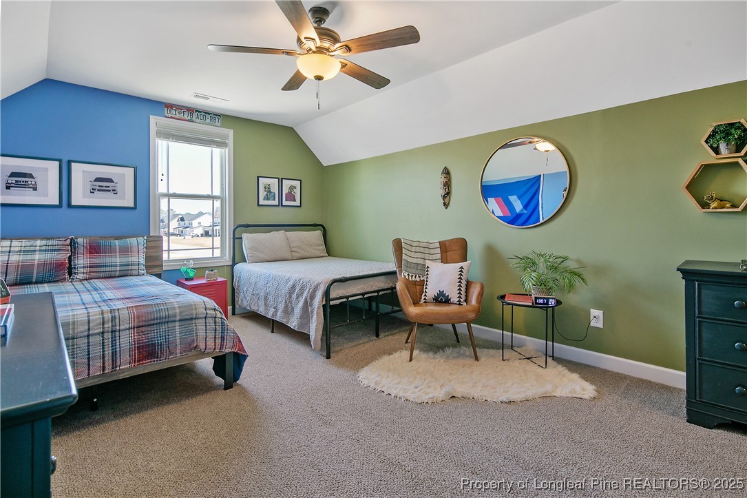 2628 Riddle Farm Road Hope Mills, NC 28348 - Photo 45 of 50 a bedroom with two beds and a window