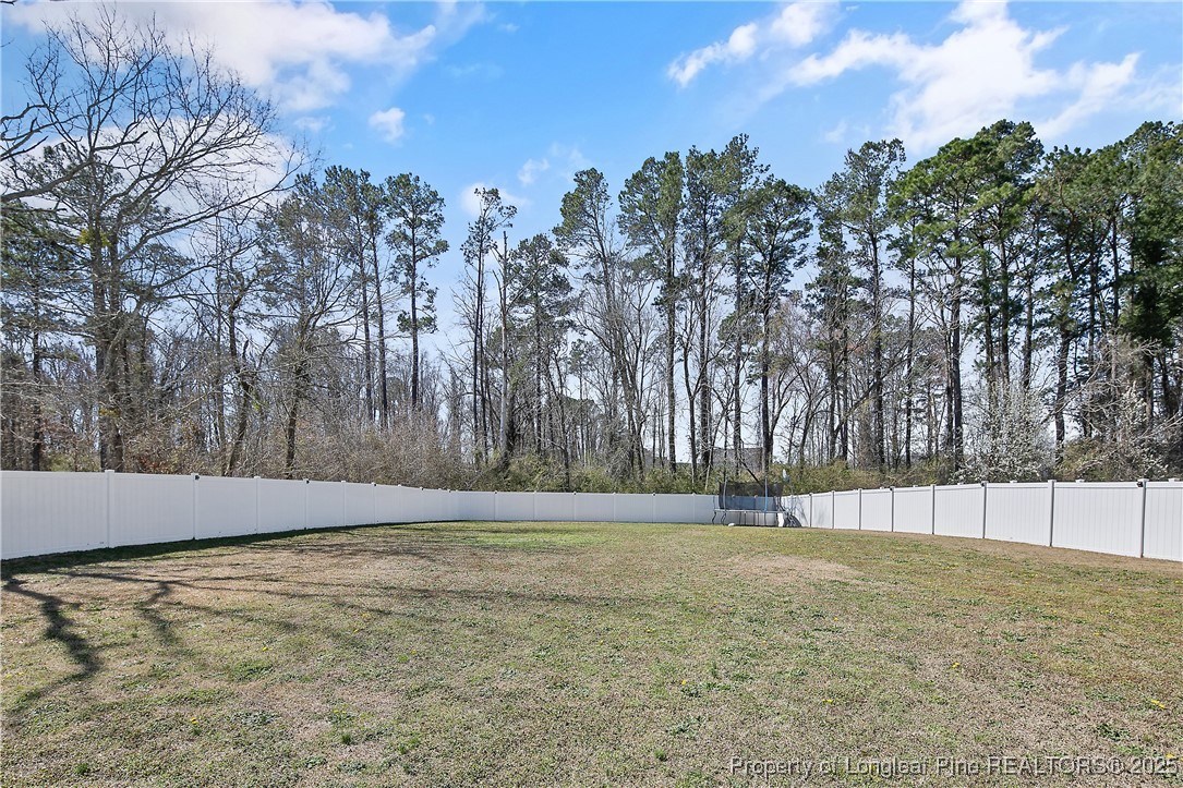2628 Riddle Farm Road Hope Mills, NC 28348 - Photo 50 of 50 a view of yard with trees in the background