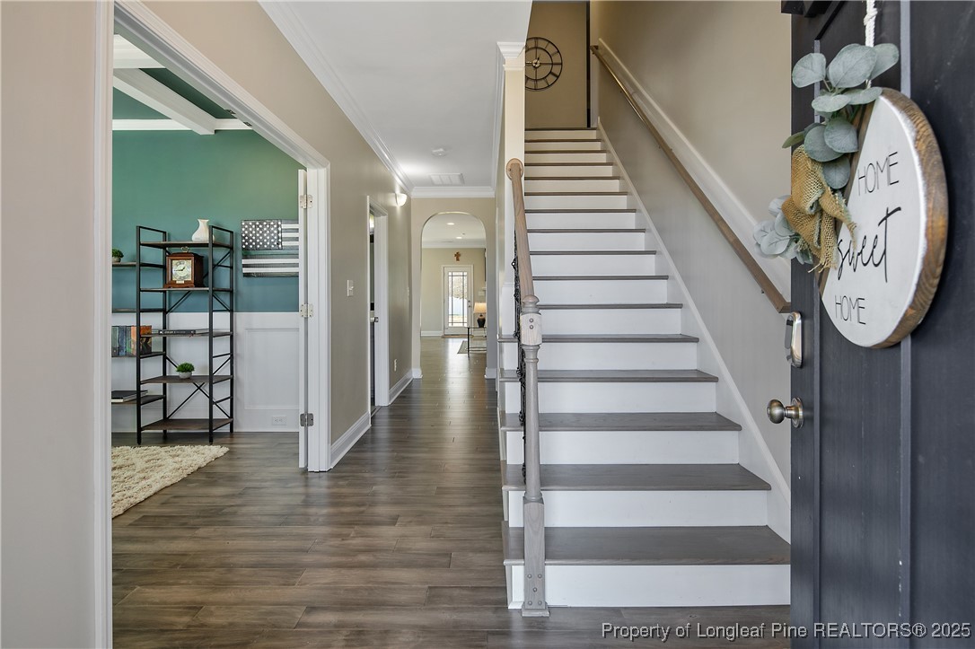 2628 Riddle Farm Road Hope Mills, NC 28348 - Photo 6 of 50 a view of a hallway with wooden floor and entryway