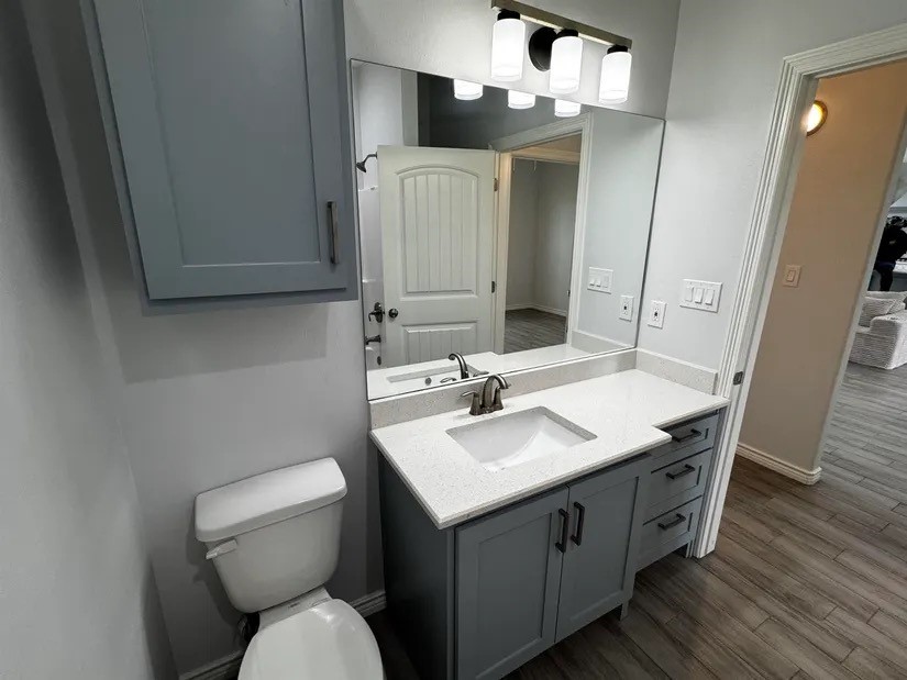 2295 Diamond D Lane Beaumont, TX 77713 - Photo 23 of 40 a bathroom with a toilet sink and mirror