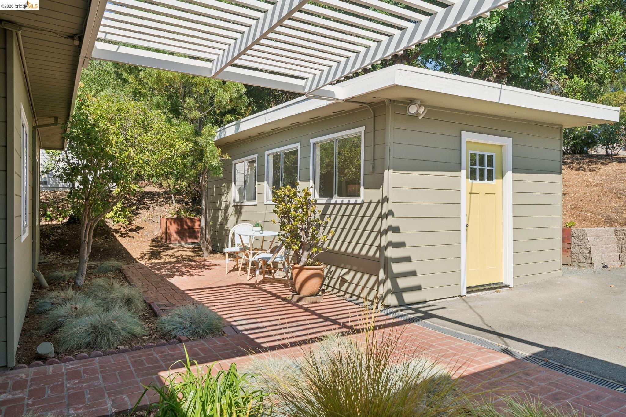 1321 Sunset Loop Lafayette, CA 94549 - Photo 25 of 49 Brick patio with a white pergola, offering an outdoor living area