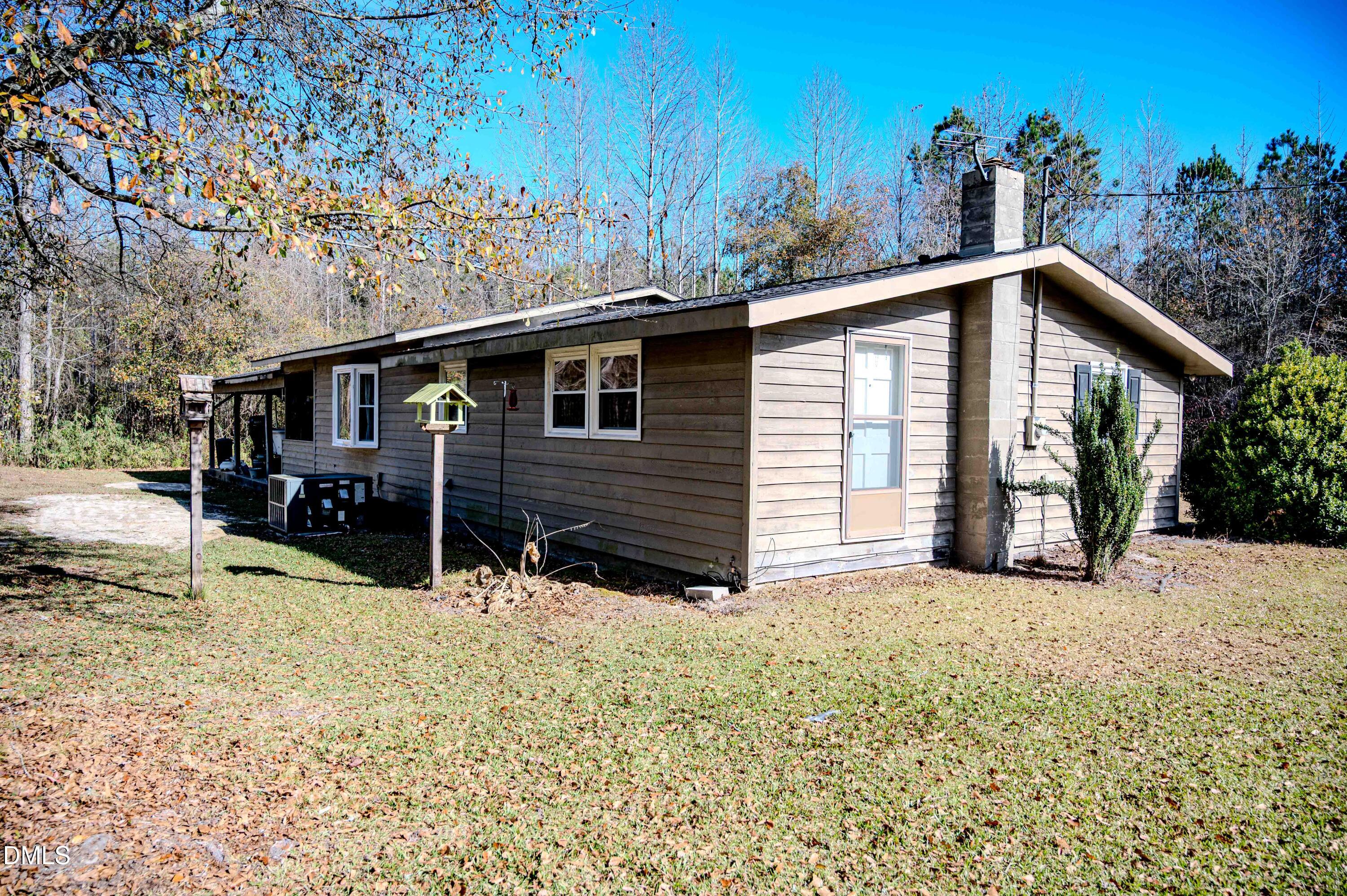 5131 Ponderosa Road Sanford, NC 27332 - Photo 14 of 51 a view of a house with a yard covered in snow