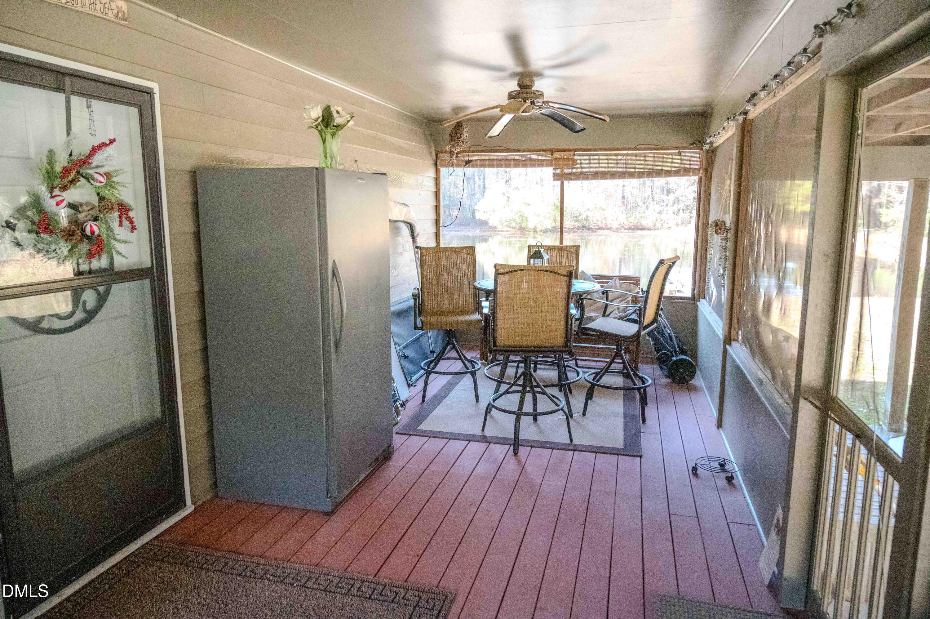 5131 Ponderosa Road Sanford, NC 27332 - Photo 19 of 51 a view of a dining room with furniture window and wooden floor