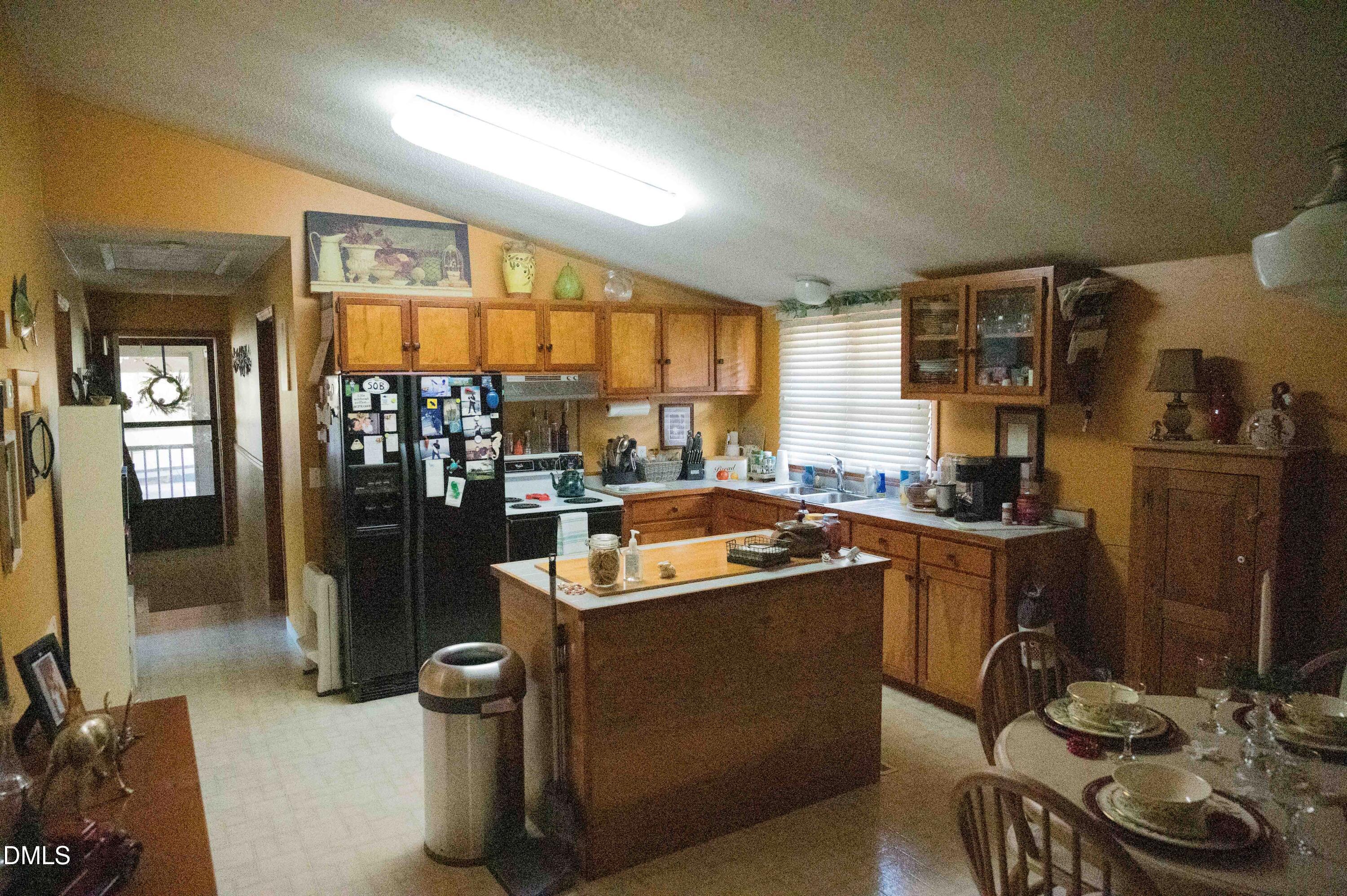 5131 Ponderosa Road Sanford, NC 27332 - Photo 22 of 51 a kitchen with stainless steel appliances granite countertop a refrigerator and a stove