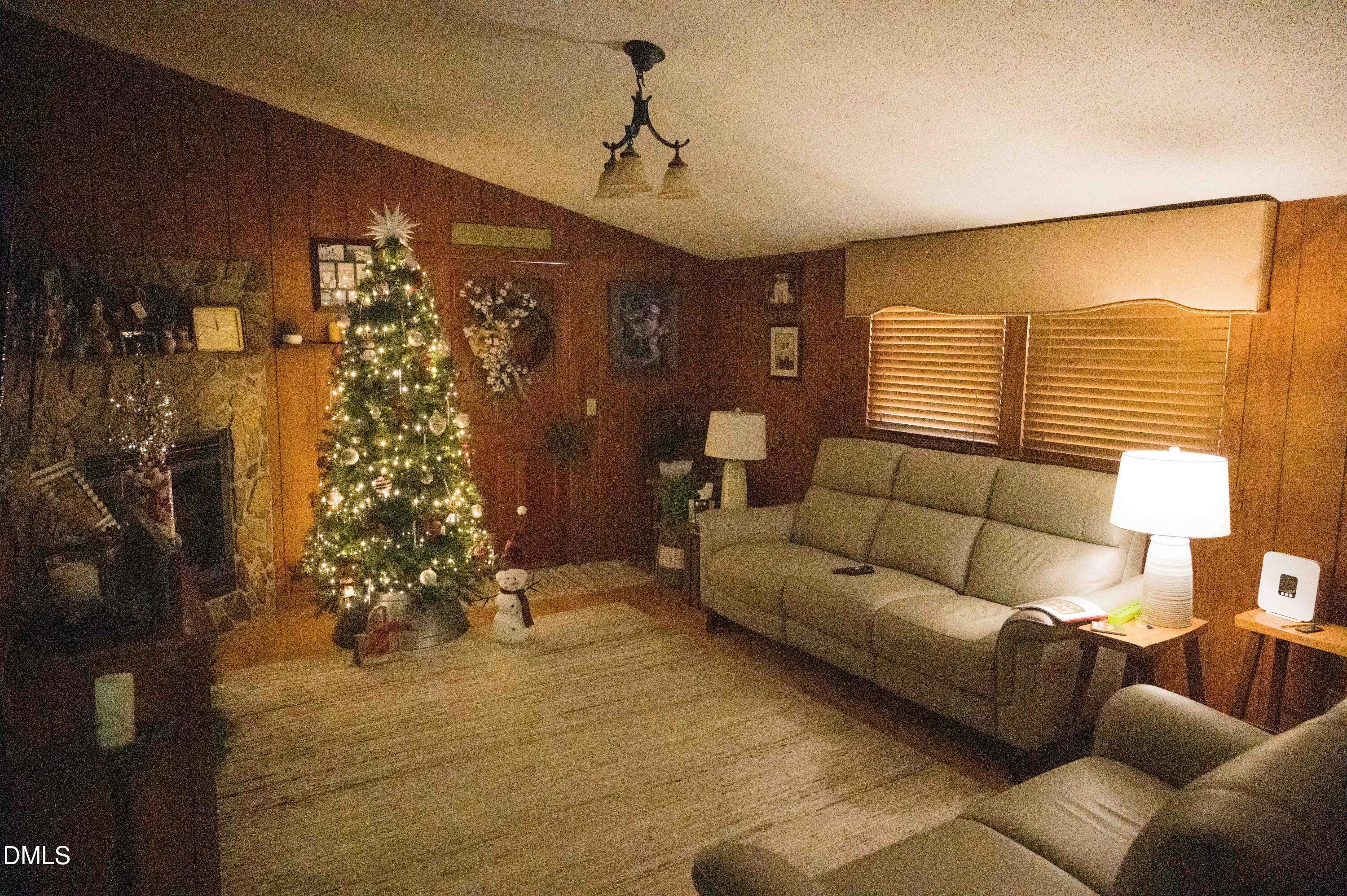 5131 Ponderosa Road Sanford, NC 27332 - Photo 23 of 51 a living room with furniture and a window