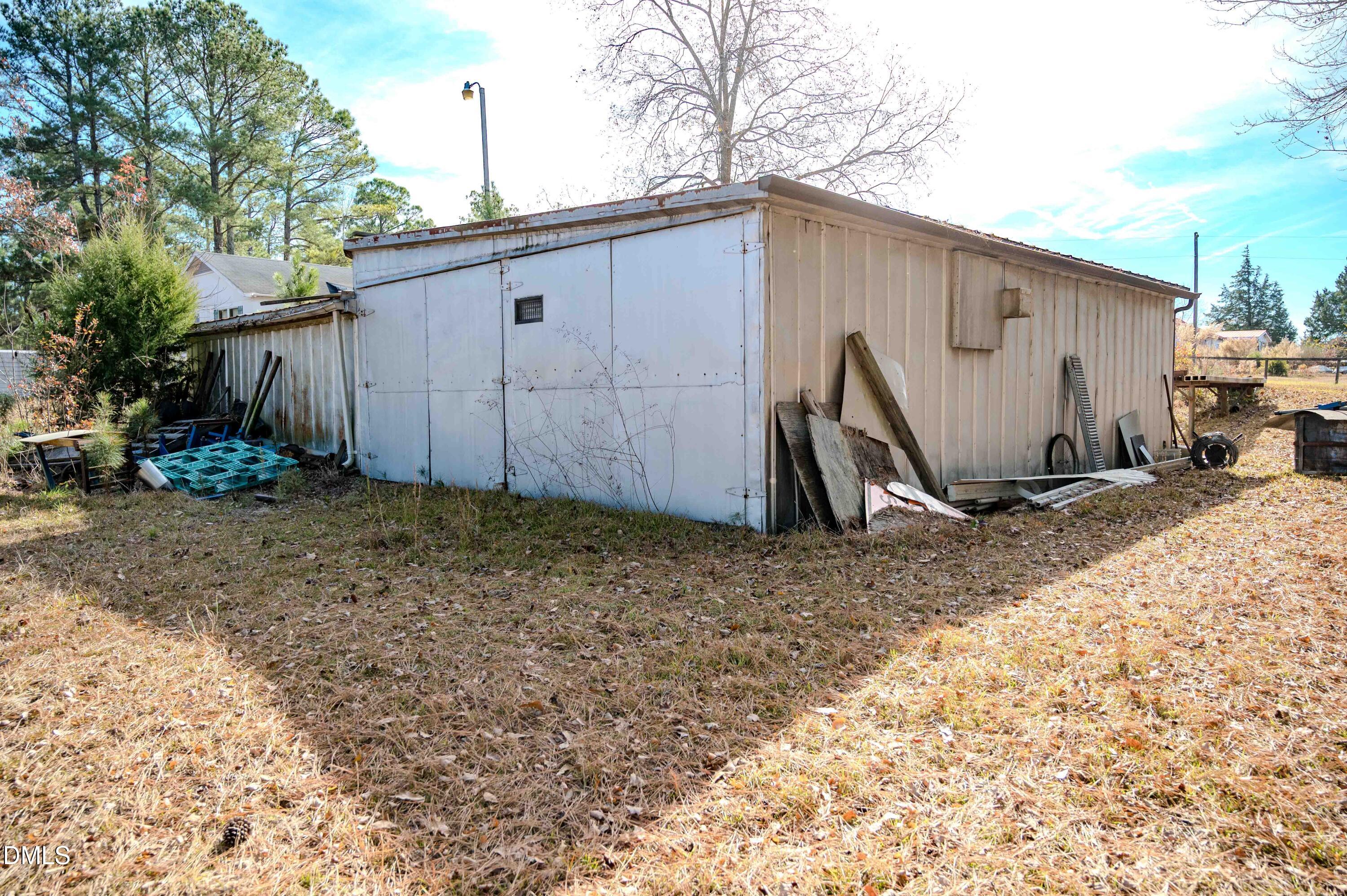 5131 Ponderosa Road Sanford, NC 27332 - Photo 39 of 51 a view of a backyard with potted plants
